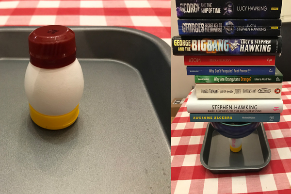 An egg supporting books