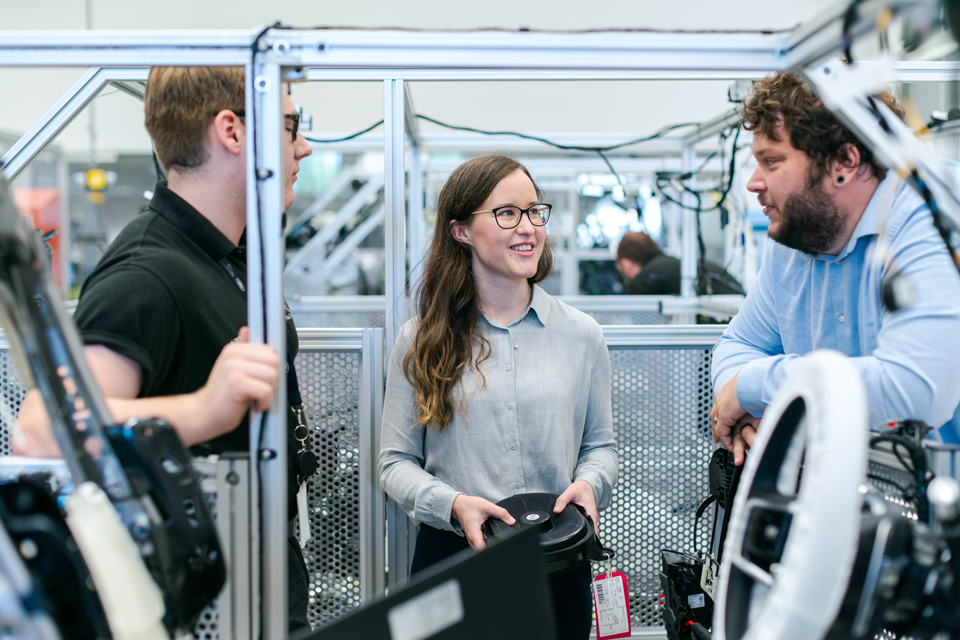 Photo of a group of engineers discussing a project