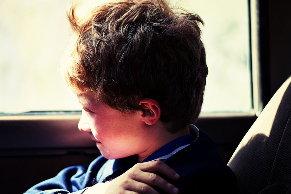 boy in car looking out of window